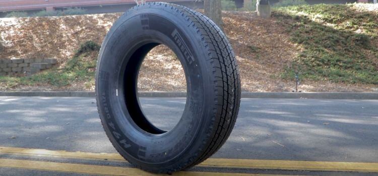 how much does a semi truck tire weigh