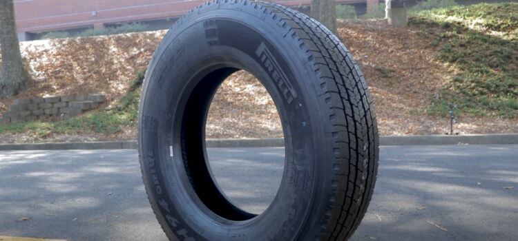 how much does a semi truck tire weigh